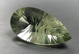 published concave cut green quartz