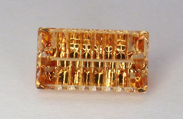 concave faceted imperial topaz