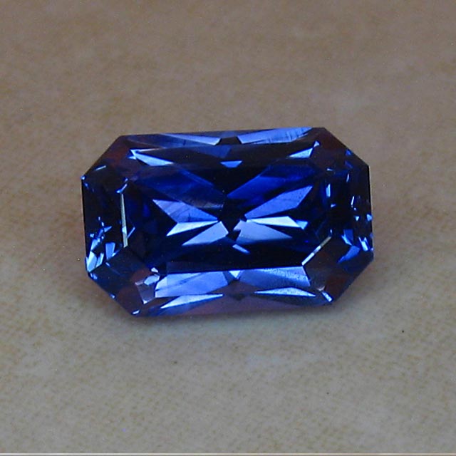 emerald cut glowing blue sapphire
